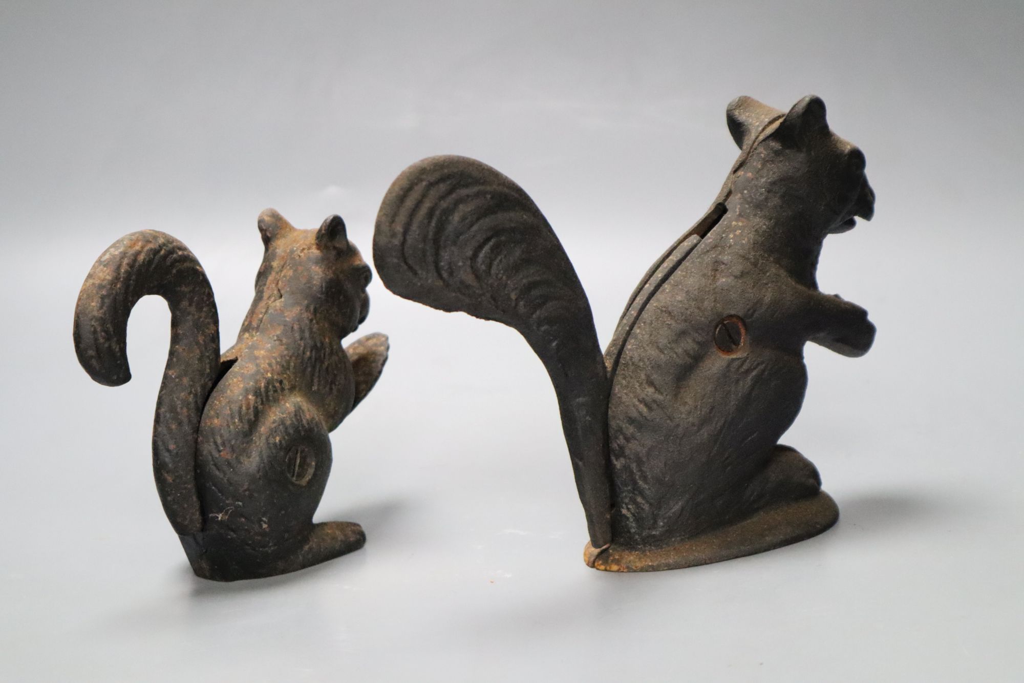 Two cast iron squirrel nutcrackers, tallest 13.5cm